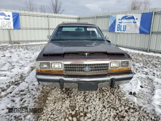 1989 Ford Crown Victoria z VIN 2FABP77F8KX129671, wystawiony jako Copart lot #86410274 z przebiegiem 58 851 mil mil oraz Szkody całkowita. Historia ofert i sprzedaży dostępna na DreamBid. Obrazek 5.