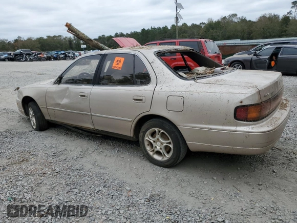 1993 Toyota Camry LE with VIN 4T1SK12E5PU316445, listed as a Copart auction lot 77534394 with 175,506 mi miles and Salvage Title. Bid and sale history available at carsss.com. Image 2.