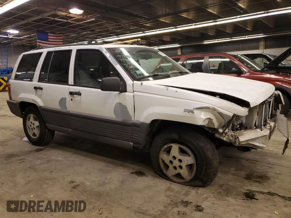 1993 Jeep Grand Cherokee Laredo with VIN 1J4GZ58SXPC554642, listed as a Copart auction lot 83268254 with 266,063 mi miles and Salvage Title. Bid and sale history available at carsss.com. Image 4.