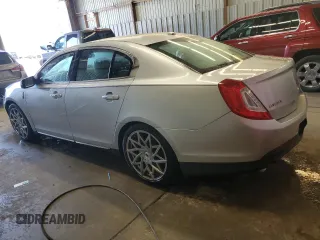 2013 Lincoln MKS z VIN 1LNHL9EK0DG605184, wystawiony jako Copart lot #51914305 z przebiegiem 173 117 mil mil oraz Szkoda całkowita • Salvage title. Historia ofert i sprzedaży dostępna na DreamBid. Obrazek 2.