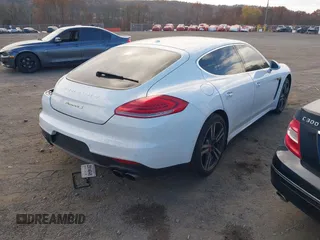 2014 Porsche Panamera S E-Hybrid with VIN WP0AD2A76EL044722, listed as a IAAI auction lot 40716615 with 52,474 mi miles and . Bid and sale history available at DreamBid. Image 4.