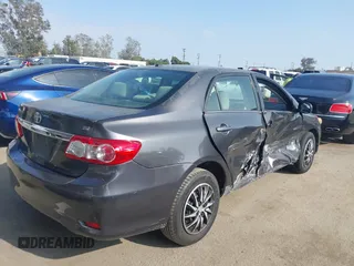 2011 Toyota Corolla L with VIN JTDBU4EE3BJ090749, listed as a IAAI auction lot 42106633 with 209,824 mi miles. Bid and sale history available at carsss.com. Image 4.