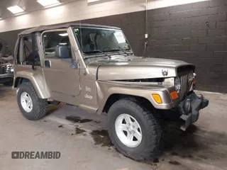 2004 Jeep Wrangler Sahara with VIN 1J4FA59S64P736389, listed as a IAAI auction lot 41432819 with 102,830 mi miles. Bid and sale history available at carsss.com. Image 1.