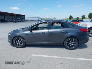 2018 Ford Focus SE z VIN 1FADP3FE6JL223294, wystawiony jako IAAI lot #42067973 z przebiegiem 74 734 mil mil oraz . Historia ofert i sprzedaży dostępna na DreamBid. Obrazek 14.