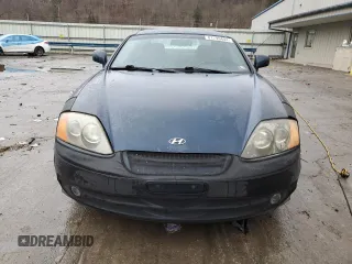 2003 Hyundai Tiburon GT z VIN KMHHN65F13U068658, wystawiony jako Copart lot #81799404 z przebiegiem 163 148 mil mil oraz Szkoda całkowita • Salvage title. Historia ofert i sprzedaży dostępna na DreamBid. Obrazek 5.
