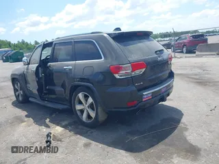 2015 Jeep Grand Cherokee Overland with VIN 1C4RJFCT9FC859740, listed as a IAAI auction lot 42187933 with 231,481 mi miles. Bid and sale history available at carsss.com. Image 3.
