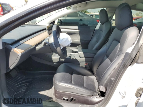 2023 Tesla Model 3 with VIN 5YJ3E1EA9PF401418, listed as a Copart auction lot 50597015 with 79,673 mi miles and Salvage Title. Bid and sale history available at DreamBid. Image 7.