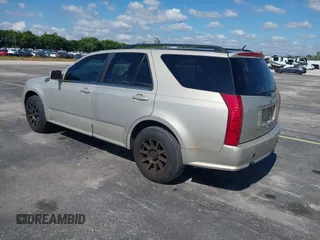 2008 Cadillac SRX AWD with VIN 1GYEE637280101842, listed as a IAAI auction lot 41417596 with 125,052 mi miles. Bid and sale history available at carsss.com. Image 3.