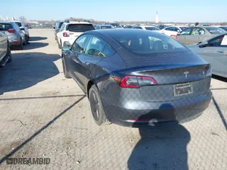 2023 Tesla Model 3 with VIN 5YJ3E1EA3PF678825, listed as a IAAI auction lot 41283153 with 8,607 mi miles. Bid and sale history available at carsss.com. Image 3.
