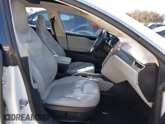 2014 Tesla Model S 60 with VIN 5YJSA1H15EFP46980, listed as a IAAI auction lot 41583672 with 61,080 mi miles and . Bid and sale history available at DreamBid. Image 5.