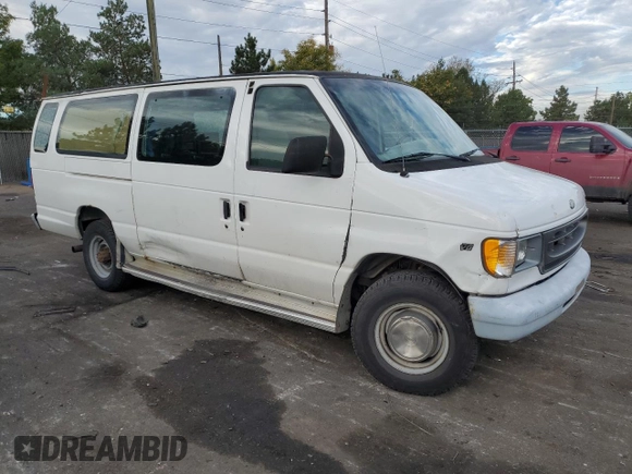 1999 Ford Econoline Passenger XL with VIN 1FBSS31L2XHA95612, listed as a Copart auction lot 72615104 with 211,283 mi miles and Salvage Title. Bid and sale history available at DreamBid. Image 4.