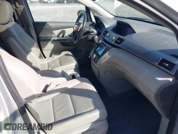 2014 Honda Odyssey EX-L with VIN 5FNRL5H61EB128311, listed as a IAAI auction lot 42334932 with 270,135 mi miles and . Bid and sale history available at DreamBid. Image 5.
