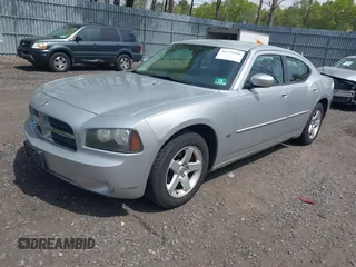 2010 Dodge Charger SXT with VIN 2B3CA3CV8AH277058, listed as a IAAI auction lot 42179056 with 162,971 mi miles. Bid and sale history available at carsss.com. Image 2.