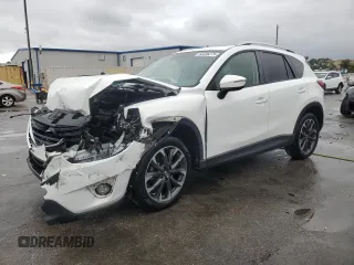 2016 Mazda CX-5 Grand Touring with VIN JM3KE2DYXG0839774, listed as a Copart auction lot 52336275 with 125,605 mi miles and Salvage Title. Bid and sale history available at carsss.com. Image 1.