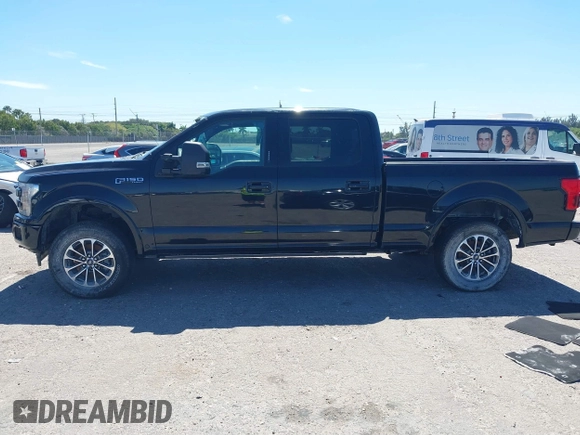 2018 Ford F-150 XL with VIN 1FTFW1EG9JFC63669, listed as a IAAI auction lot 41748012 with 143,584 mi miles. Bid and sale history available at carsss.com. Image 14.