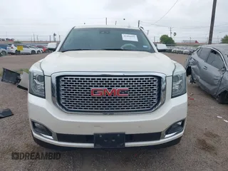 2015 GMC Yukon Denali z VIN 1GKS1CKJ3FR713531, wystawiony jako IAAI lot #41866691 z przebiegiem 157 666 mil mil oraz . Historia ofert i sprzedaży dostępna na DreamBid. Obrazek 13.