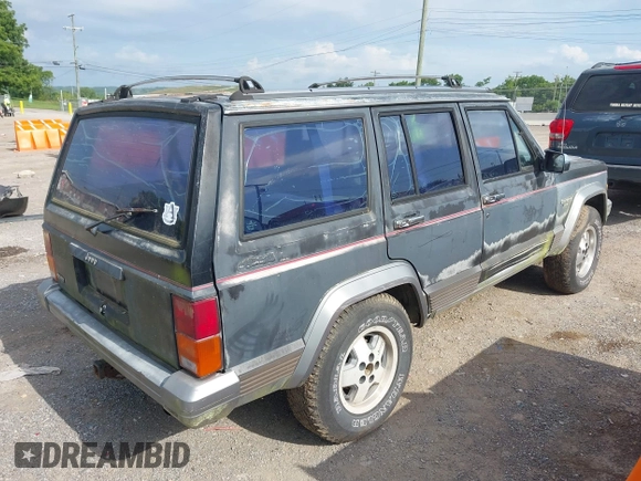 1991 Jeep Cherokee z VIN 1J4FJ58S6ML572036, wystawiony jako IAAI lot #42659999 z przebiegiem 200 845 mil mil oraz . Historia ofert i sprzedaży dostępna na DreamBid. Obrazek 4.