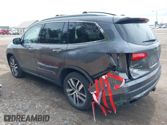 2017 Honda Pilot Touring with VIN 5FNYF6H92HB012090, listed as a IAAI auction lot 41882542 with 110,179 mi miles and . Bid and sale history available at DreamBid. Image 3.