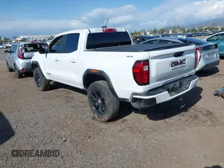 2024 GMC Canyon 4WD Elevation with VIN 1GTP6BEK9R1130353, listed as a IAAI auction lot 41967300 with 10,966 mi miles and . Bid and sale history available at carsss.com. Image 3.