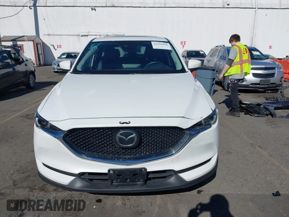2021 Mazda CX-5 Grand Touring with VIN JM3KFBDM6M0483135, listed as a IAAI auction lot 41590430 with 33,466 mi miles. Bid and sale history available at carsss.com. Image 12.