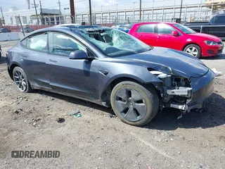 2023 Tesla Model 3 Long Range z VIN 5YJ3E1EB4PF715776, wystawiony jako IAAI lot #41949969 z przebiegiem Nie podano mil oraz . Historia ofert i sprzedaży dostępna na DreamBid. Obrazek 1.
