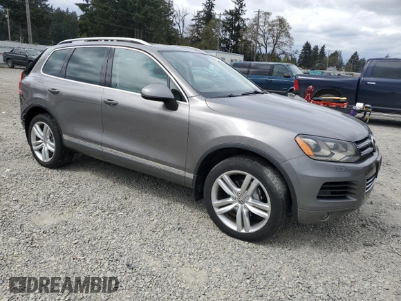 2012 Volkswagen Touareg Sport with VIN WVGFK9BP4CD001860, listed as a Copart auction lot 55090375 with 153,456 mi miles and Salvage title. Bid and sale history available at DreamBid. Image 4.