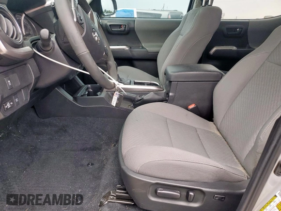 2023 Toyota Tacoma SR5 с VIN 3TMAZ5CNXPM213141, выставлен на аукционе Copart как лот 56695745 с пробегом 6 021 миль миль и Списание • Salvage title. История ставок и продаж доступна на DreamBid. Изображение 7.