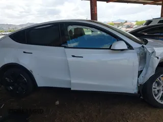 2021 Tesla Model Y Long Range with VIN 5YJYGAEE9MF254113, listed as a IAAI auction lot 42045256 with Not Provided miles. Bid and sale history available at carsss.com. Image 12.