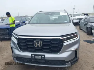 2023 Honda Pilot Touring with VIN 5FNYG2H75PB014662, listed as a IAAI auction lot 41889246 with 14,413 mi miles. Bid and sale history available at carsss.com. Image 12.
