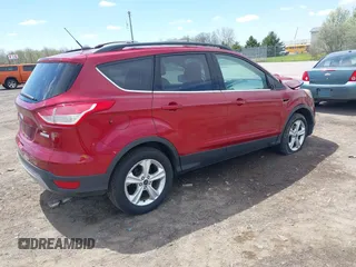 2014 Ford Escape SE with VIN 1FMCU0GX5EUB58169, listed as a IAAI auction lot 42155452 with 89,002 mi miles and . Bid and sale history available at DreamBid. Image 4.