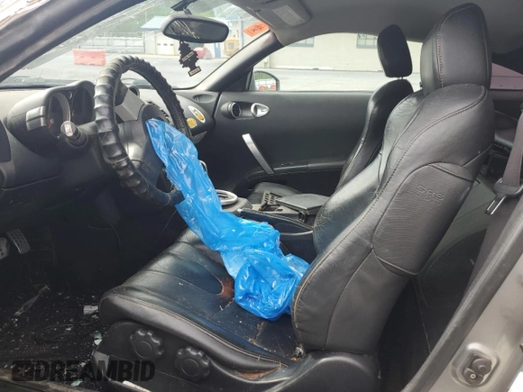 2005 Nissan 350Z Touring z VIN JN1AZ34E05M654954, wystawiony jako Copart lot #57591085 z przebiegiem Nie podano mil oraz Tytuł czysty. Historia ofert i sprzedaży dostępna na DreamBid. Obrazek 7.