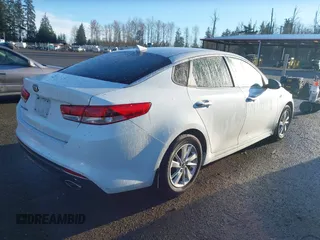 2016 Kia Optima LX with VIN 5XXGT4L31GG034993, listed as a IAAI auction lot 41881231 with 81,888 mi miles. Bid and sale history available at carsss.com. Image 4.