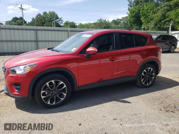 2016 Mazda CX-5 Grand Touring z VIN JM3KE2DY0G0722334, wystawiony jako Copart lot #59998185 z przebiegiem 51 449 mil mil oraz Szkoda całkowita • Salvage title. Historia ofert i sprzedaży dostępna na DreamBid. Obrazek 1.