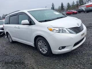 2014 Toyota Sienna XLE with VIN 5TDYK3DC2ES485846, listed as a IAAI auction lot 41693092 with 106,156 mi miles. Bid and sale history available at carsss.com. Image 1.