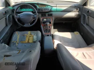 1997 Mazda Millenia z VIN JM1TA2213V1308406, wystawiony jako Copart lot #74141674 z przebiegiem 205 115 mil mil oraz Tytuł czysty. Historia ofert i sprzedaży dostępna na DreamBid. Obrazek 8.