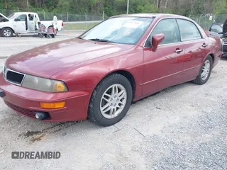 2000 Mitsubishi Diamante LS z VIN 6MMAP67P4YT003358, wystawiony jako IAAI lot #42112046 z przebiegiem 266 341 mil mil oraz . Historia ofert i sprzedaży dostępna na DreamBid. Obrazek 2.