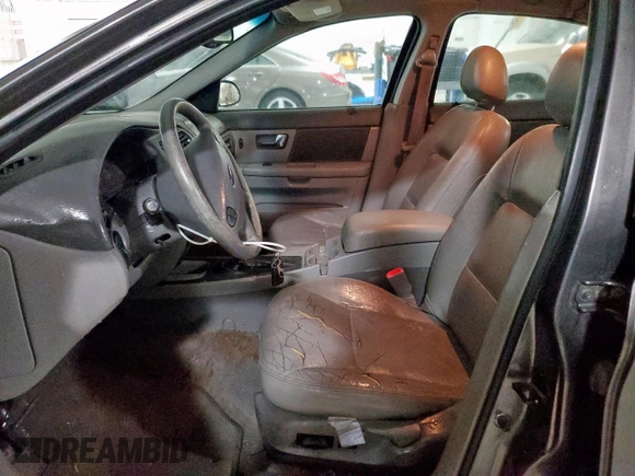 2002 Ford Taurus SES Standard z VIN 1FAFP55U72A161401, wystawiony jako Copart lot #55893125 z przebiegiem 128 258 mil mil oraz Czysty tytuł • Clean title. Historia ofert i sprzedaży dostępna na DreamBid. Obrazek 7.
