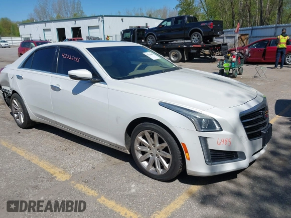 2015 Cadillac CTS Luxury AWD with VIN 1G6AX5SX5F0103725, listed as a IAAI auction lot 42226485 with 112,437 mi miles and . Bid and sale history available at DreamBid. Image 1.