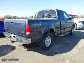 2000 Ford F-150 XL with VIN 1FTRX18L2YKA10388, listed as a IAAI auction lot 41526430 with 144,480 mi miles. Bid and sale history available at carsss.com. Image 4.