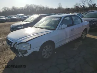 2005 Kia Optima LX z VIN KNAGD128855395645, wystawiony jako Copart lot #49330135 z przebiegiem 84 368 mil mil oraz Szkoda całkowita • Salvage title. Historia ofert i sprzedaży dostępna na DreamBid. Obrazek 1.