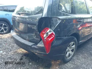 2014 Subaru Forester 2.5i with VIN JF2SJAAC5EH512996, listed as a IAAI auction lot 42480386 with 102,944 mi miles and . Bid and sale history available at DreamBid. Image 6.
