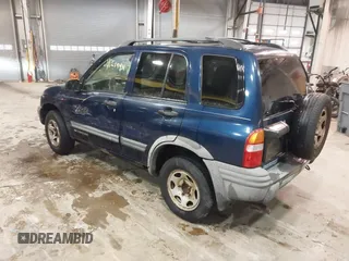 2003 Chevrolet Tracker ZR2 z VIN 2CNBJ734736905310, wystawiony jako IAAI lot #41519431 z przebiegiem 177 643 mil mil oraz . Historia ofert i sprzedaży dostępna na DreamBid. Obrazek 3.