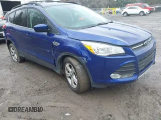 2016 Ford Escape SE with VIN 1FMCU9GX1GUA89312, listed as a IAAI auction lot 42024041 with 142,807 mi miles. Bid and sale history available at carsss.com. Image 1.