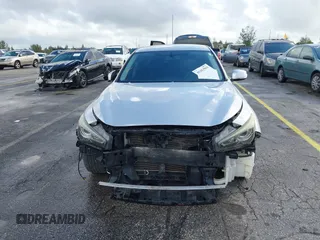 2015 Infiniti Q50 Premium with VIN JN1BV7AP9FM358782, listed as a IAAI auction lot 41103963 with 96,853 mi miles. Bid and sale history available at carsss.com. Image 13.