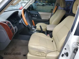2003 Mitsubishi Montero Limited z VIN JA4NW51S23J020616, wystawiony jako Copart lot #56036365 z przebiegiem 200 785 mil mil oraz Szkody całkowita. Historia ofert i sprzedaży dostępna na DreamBid. Obrazek 7.