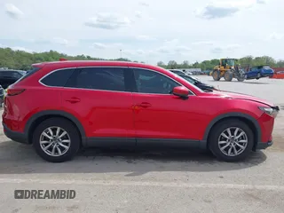 2016 Mazda CX-9 Touring with VIN JM3TCACY4G0112961, listed as a IAAI auction lot 42094718 with 114,679 mi miles and . Bid and sale history available at DreamBid. Image 13.