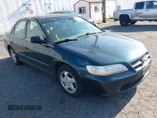 1999 Honda Accord EX z VIN JHMCG5651XC029037, wystawiony jako IAAI lot #42184602 z przebiegiem 165 832 mil mil oraz . Historia ofert i sprzedaży dostępna na DreamBid. Obrazek 1.