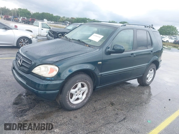 2000 Mercedes-Benz M 320/430/500 with VIN 4JGAB54E0YA218894, listed as a IAAI auction lot 41985116 with 120,889 mi miles and . Bid and sale history available at DreamBid. Image 2.