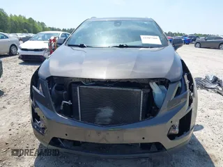 2019 Cadillac XT5 Luxury AWD z VIN 1GYKNDRS9KZ235687, wystawiony jako IAAI lot #41987360 z przebiegiem 78 784 mil mil oraz . Historia ofert i sprzedaży dostępna na DreamBid. Obrazek 13.
