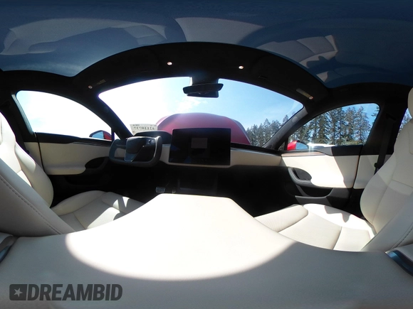 2023 Tesla Model S with VIN 5YJSA1E5XPF516779, listed as a IAAI auction lot 42110737 with 16,465 mi miles and . Bid and sale history available at DreamBid. Image 21.